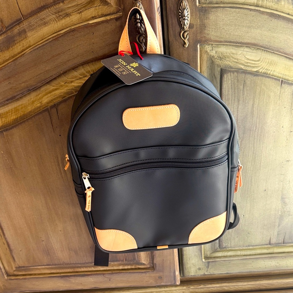 Jon Hart black and tan back pack.